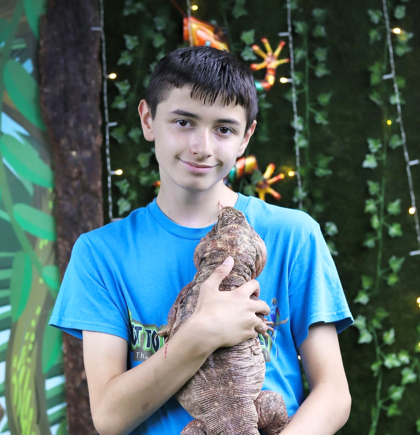 Harry the child who is suffers from autism and sensory processing disorder with the animals at the zoo.