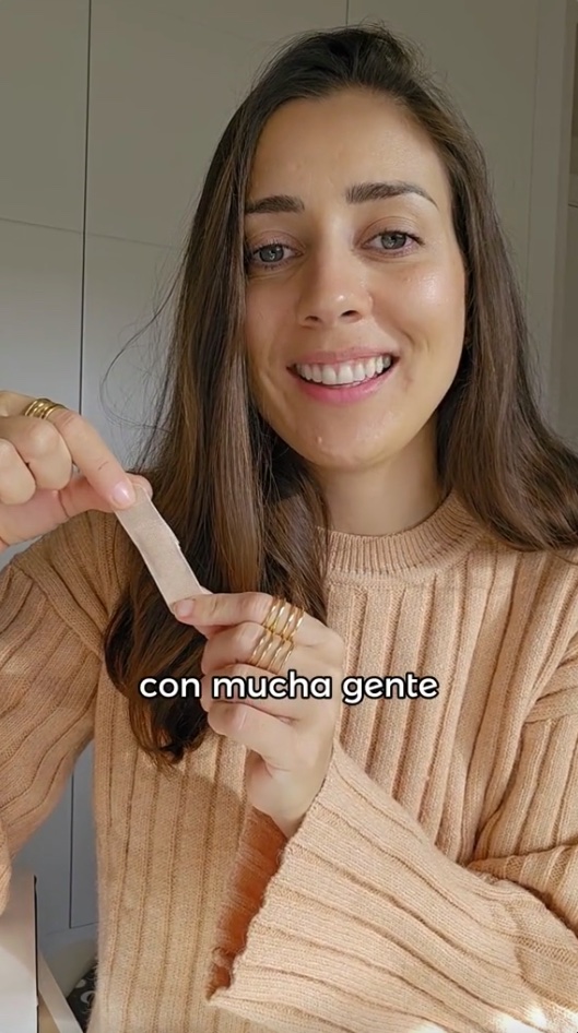 A video grab of María claiming to cover up her belly button with a plaster to protect herself against negative energy.