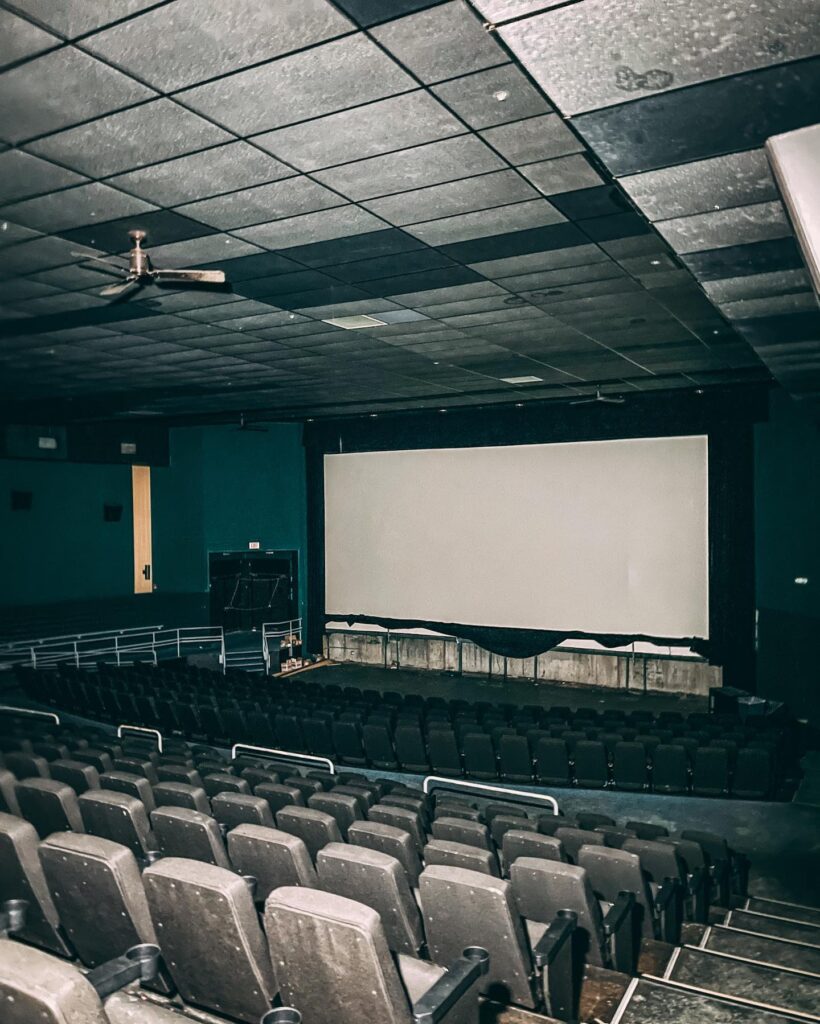 Theatre Screens, With Eerily abandoned seats. Inside the abandoned cinema left forgotten-in-time since 2020.