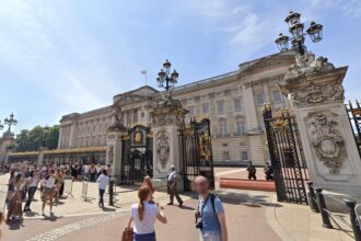 Outside Buckingham Palace, where King Charles hiring a royal phone operator.