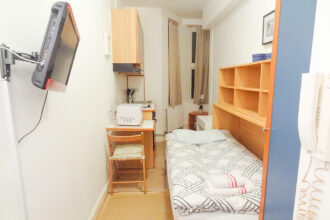 The flat available for rent with very limited space. This shows the narrow studio apartment.
