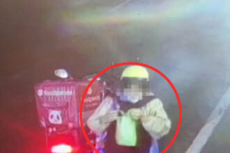 Video grab of the delivery driver eating a customer’s fried chicken.