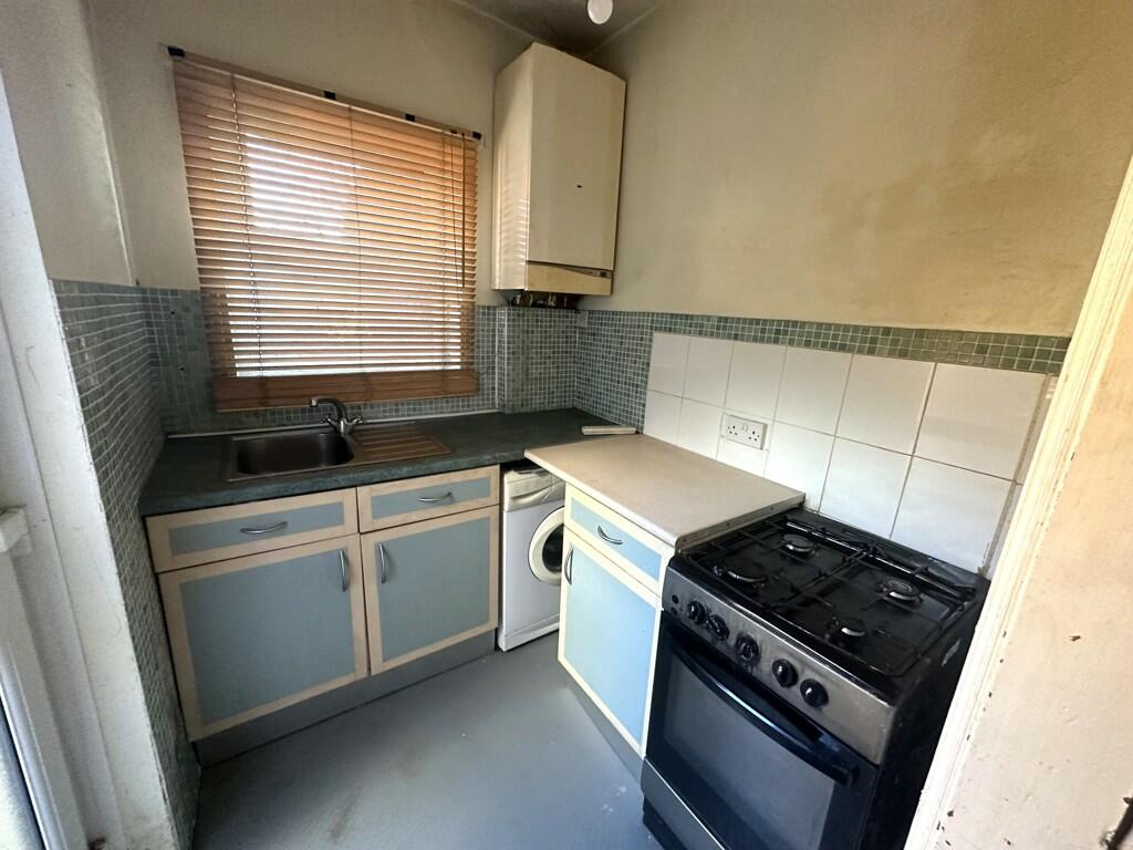 The property for sale in Sheffield with an oddly located washing machine. This shows the kitchen with the washing machine.