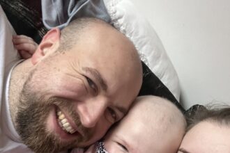 Molly and her parents, Nadia and Lewis during her diagnosis.