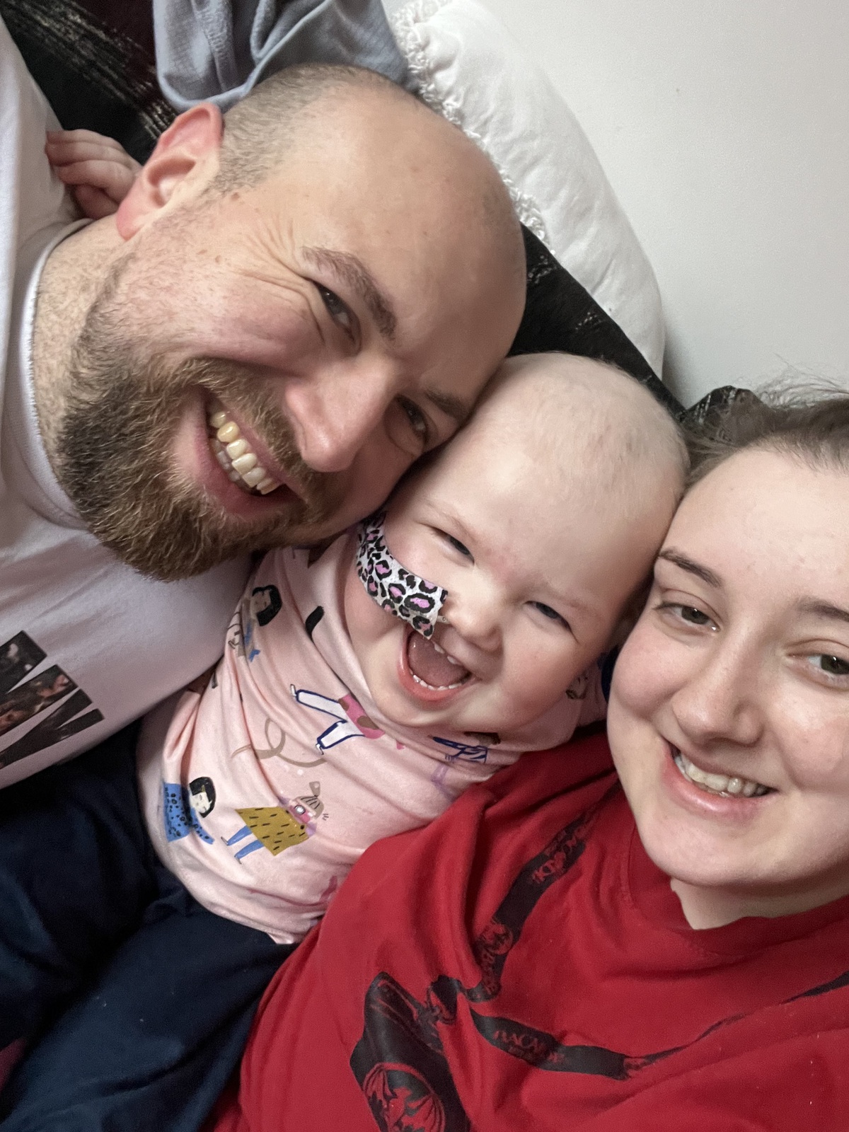 Molly and her parents, Nadia and Lewis during her diagnosis.