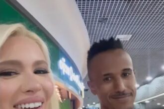 Karoline Lima with the lookalike of Brazil defender Militão’s at Recife International Airport, Brazil.