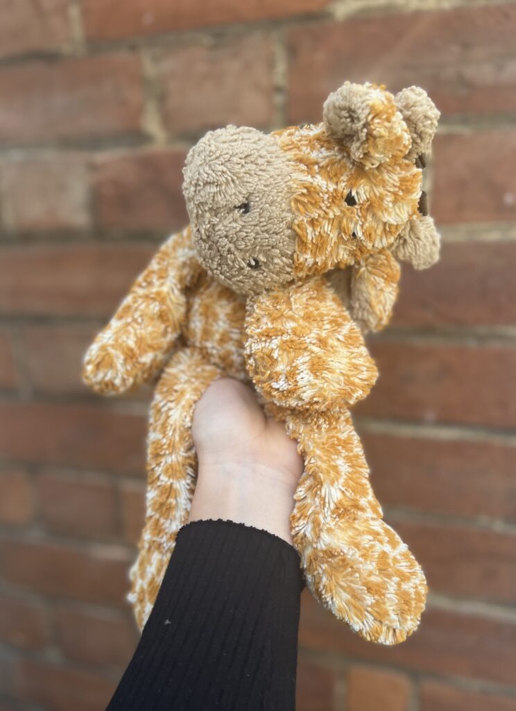 A giraffe soft toy before being cleaned and refurbished.