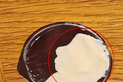 The yoghurt pot lid featuring the pattern that bears an uncanny resemblance to Alfred Hitchcock, leaves social media users shocked.