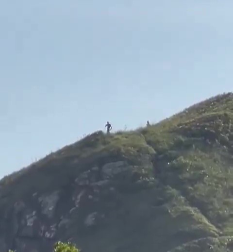 Video grab (cropped) - 'Peter Crouch' Liverpool striker on holiday with his family - Seen by some as 3m tall aliens in brazil.