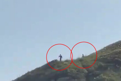 Video grab (cropped) - 'Peter Crouch' Liverpool striker on holiday with his family - Seen by some as 3m tall aliens in brazil.