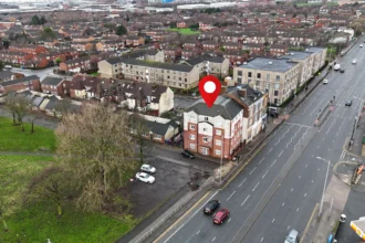 outside the £1 flat located in the centre of Liverpool available is up for auction.