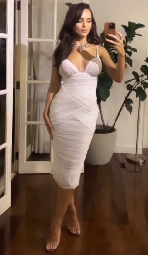 model and actress, Rafa Kalimann wearing white Dolce & Gabbana gown.
