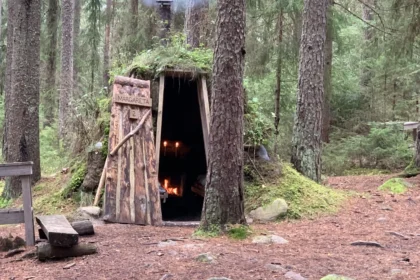 Outside the basic traditional wood and mud huts at the Kolarybn Eco Lodge located in the forests of Sweden are available for renting.
