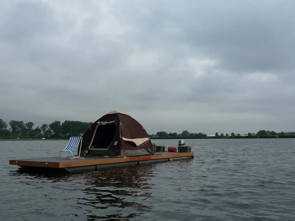 Experience a unique stay on a self-made raft in the Netherlands for £64 a night. Enjoy tranquility and the thrill of being your own captain on the water.