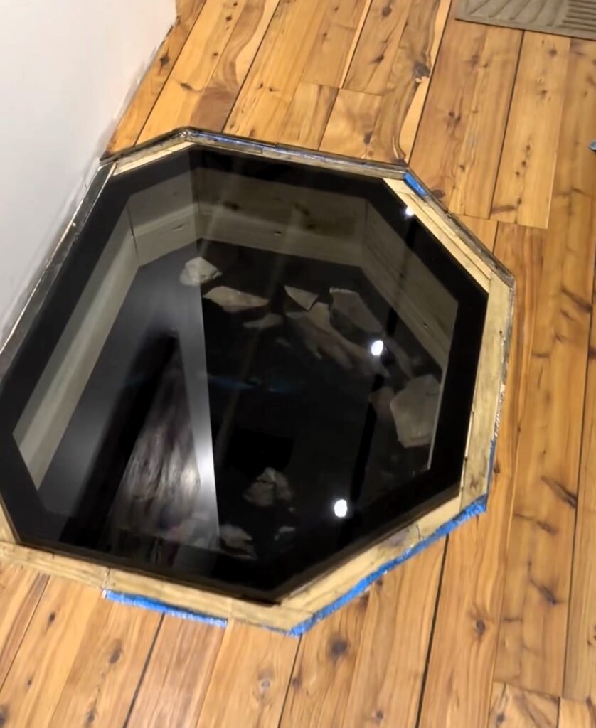 A couple discovers a hidden historical well under their floorboards from the 1850s. They preserve it as "The Well of Forgiveness" in their gallery, creating a conversation piece and honoring its past.