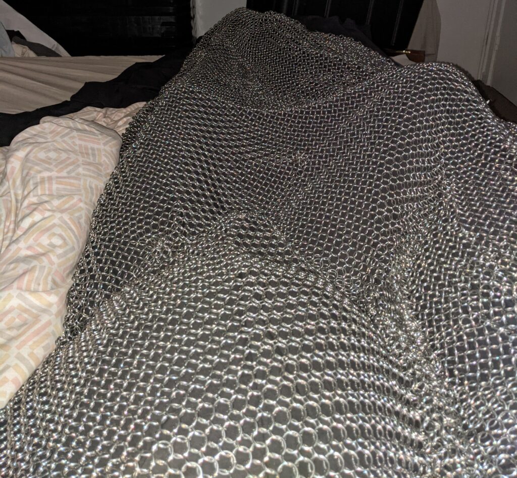 Welding enthusiast crafts his own chainmail blanket for cozy armor. Using aluminum wire, Jesse Fowler handcrafted the unique weighted blanket for a comfortable yet medieval-inspired sleep, goes viral online.