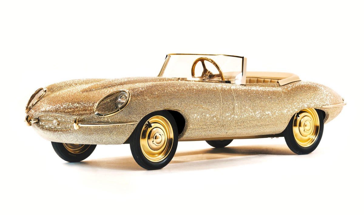 Pedal-powered half-size E-Type Jaguar bedazzled with 100,000 Swarovski crystals and gold plating up for auction at RM Sotheby’s in Dubai.