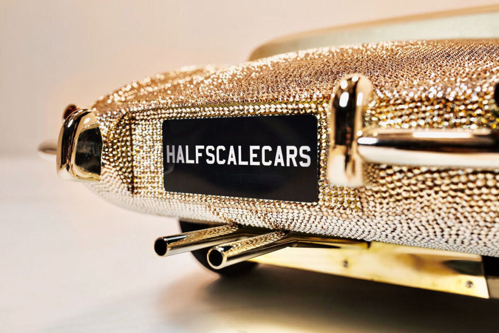 Pedal-powered half-size E-Type Jaguar bedazzled with 100,000 Swarovski crystals and gold plating up for auction at RM Sotheby’s in Dubai.