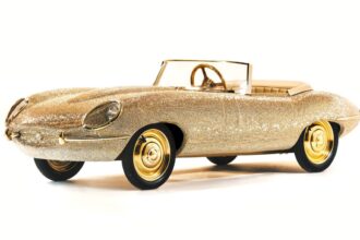 Pedal-powered half-size E-Type Jaguar bedazzled with 100,000 Swarovski crystals and gold plating up for auction at RM Sotheby’s in Dubai.