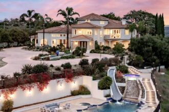 A mansion known as the 'Hype House' among TikTok influencers hits the market for $5.5M in Los Angeles. Featuring eight bedrooms, a home theatre, and a pool with a waterslide and swim-up bar, it offers luxurious living and stunning views.