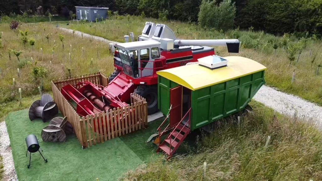 A farmer converts a £5,000 Massey Ferguson 860 combine harvester into a unique holiday home for £20,000. Named "Kaleb," it offers a cosy BnB experience with insulation, heating, and rustic decor. Situated on an old RAF base near Skegness, Lincolnshire.