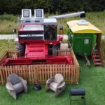 A farmer converts a £5,000 Massey Ferguson 860 combine harvester into a unique holiday home for £20,000. Named "Kaleb," it offers a cosy BnB experience with insulation, heating, and rustic decor. Situated on an old RAF base near Skegness, Lincolnshire.