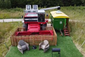 A farmer converts a £5,000 Massey Ferguson 860 combine harvester into a unique holiday home for £20,000. Named "Kaleb," it offers a cosy BnB experience with insulation, heating, and rustic decor. Situated on an old RAF base near Skegness, Lincolnshire.