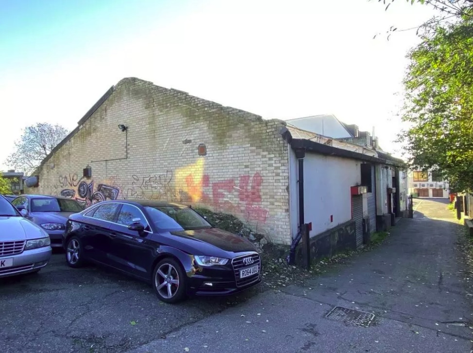 Inside the roofless garage available for sale at an auction 0.3 miles from Edgware Underground Station.