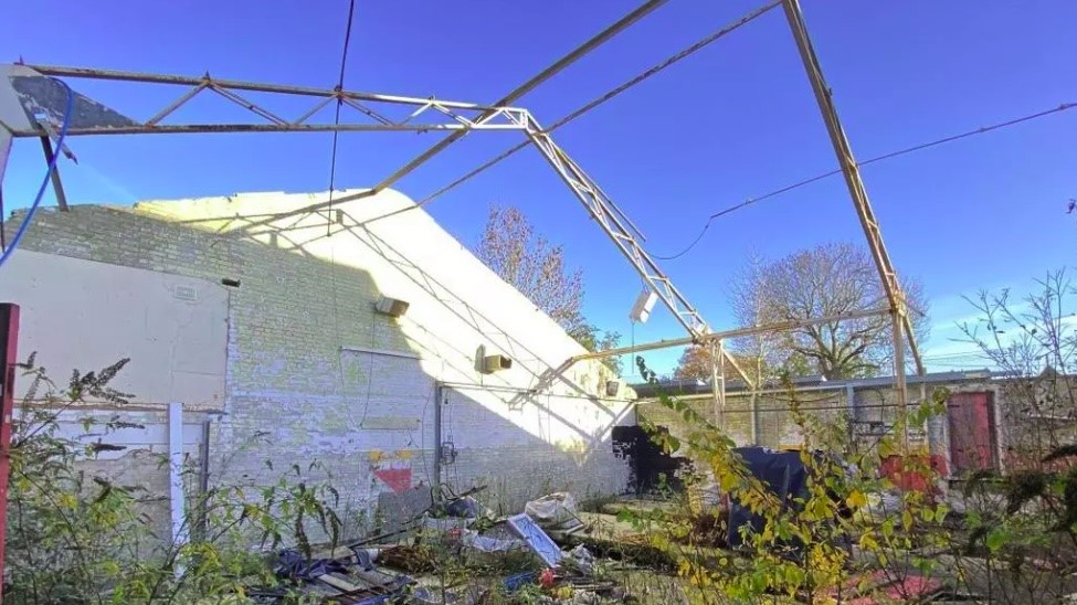 Inside the roofless garage available for sale at an auction 0.3 miles from Edgware Underground Station.