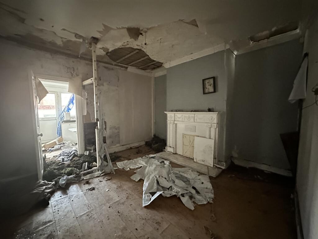 Renovators dream: Spacious terraced house in Barnsley for £30k. Needs work: hole in wall, collapsed ceiling, filled bathroom soil. Potential rental income £700/month. Auction 18 March.