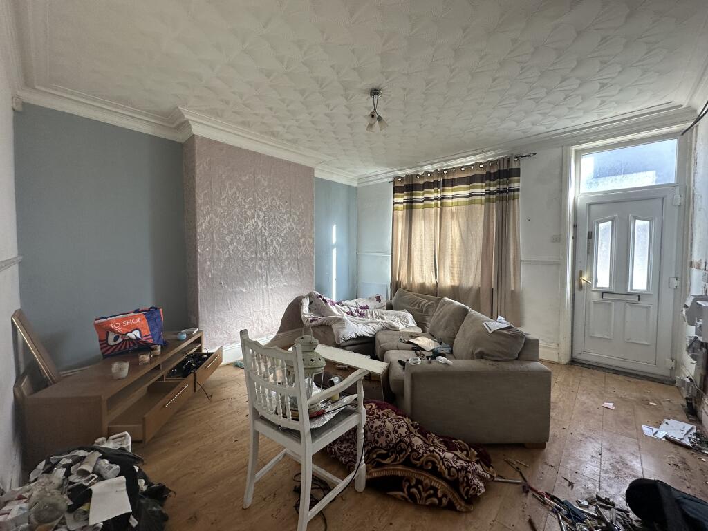Renovators dream: Spacious terraced house in Barnsley for £30k. Needs work: hole in wall, collapsed ceiling, filled bathroom soil. Potential rental income £700/month. Auction 18 March.