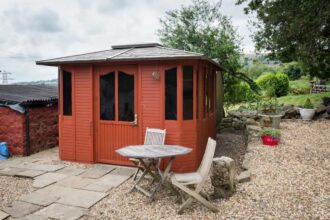 outside the unique stay awaits in Pontypool, Wales, as hosts Richie and Hester offer their transformed hot tub room for rent, complete with WiFi and friendly poultry companions.