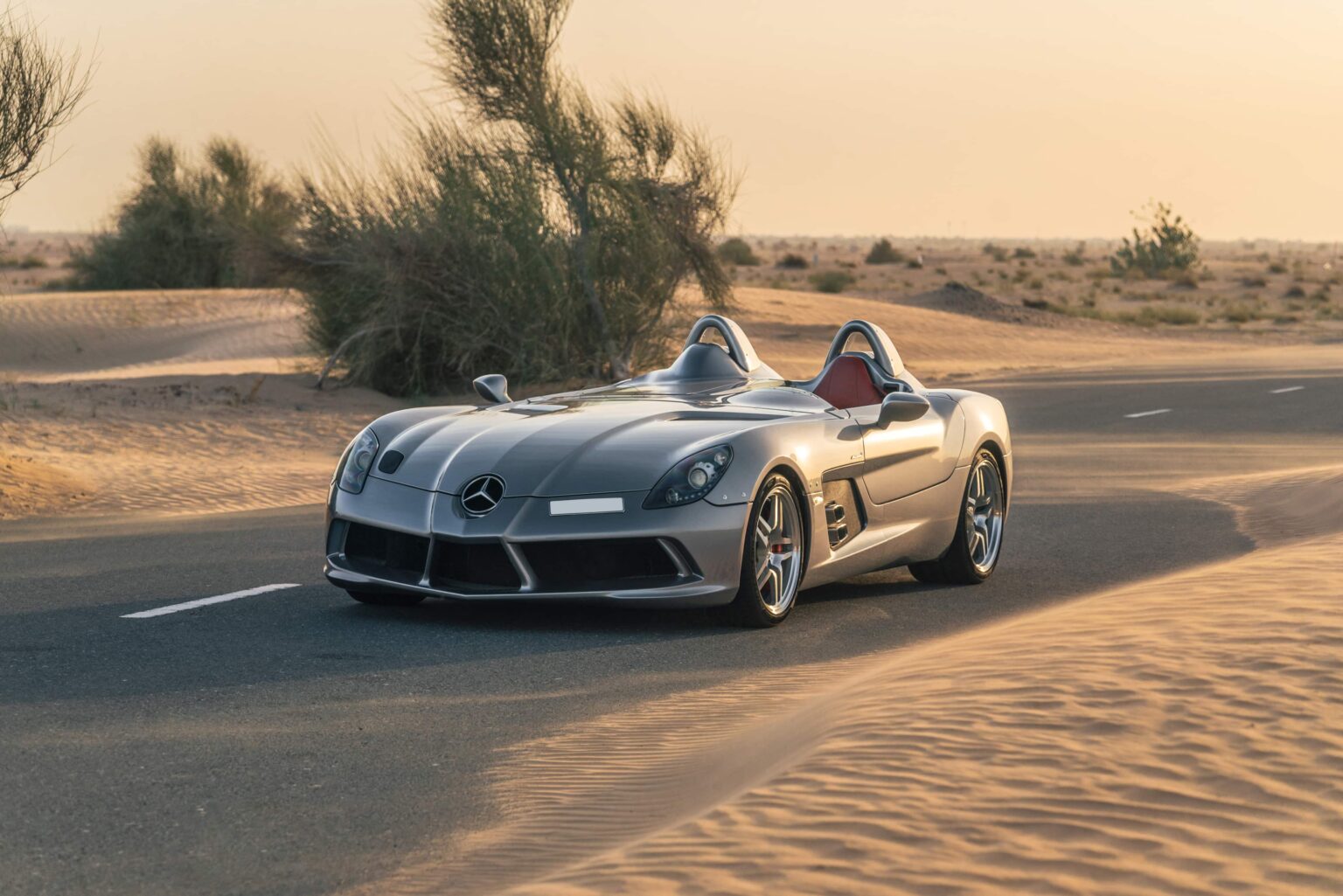 the Mercedes-Benz SLR McLaren Stirling Moss, reaching 219mph, now priced at £2.7 million. With only 75 ever made, it's a rare gem. Inspired by Sir Stirling Moss’ 1955 Mille Miglia victory, its design pays homage to motorsport history. Despite its rarity, it has tripled in value, now auctioned by RM Sotheby’s.