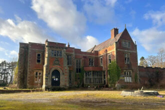 outside the Saltburn-style stately home available for sale, Otterburn Hall in Newcastle offers 25 bedrooms, and 16 acres of woodland.