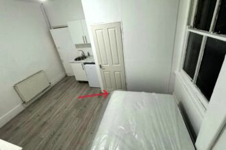 A studio apartment in West Hampstead, London, is on the market for £1,250 per month, but its small size means the bed blocks the door, leaving tenants with limited space.
