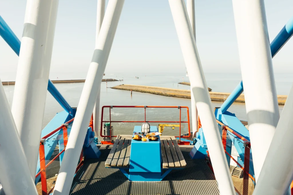 unique stay in the 'Havenkraan van Harlingen' crane in The Netherlands, offering panoramic sea views and luxurious amenities.