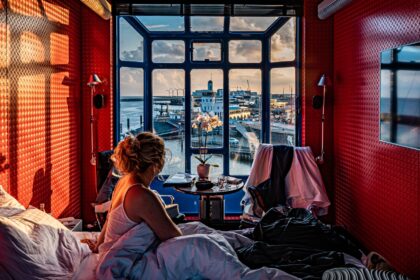 unique stay in the 'Havenkraan van Harlingen' crane in The Netherlands, offering panoramic sea views and luxurious amenities.