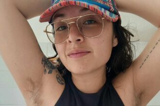 Aria Loca proudly flaunts her hairy legs despite public stares, asserting women don't need to conform to societal beauty standards. While her dating life faced challenges, she finds support online for her natural look.