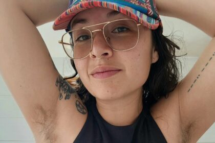 Aria Loca proudly flaunts her hairy legs despite public stares, asserting women don't need to conform to societal beauty standards. While her dating life faced challenges, she finds support online for her natural look.