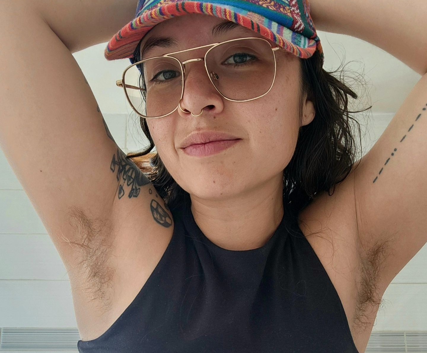 Aria Loca proudly flaunts her hairy legs despite public stares, asserting women don't need to conform to societal beauty standards. While her dating life faced challenges, she finds support online for her natural look.