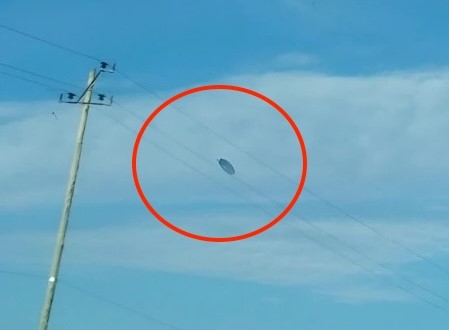 elderly couple on holiday in Argentina were amazed when they captured photos of a UFO while taking snapshots of the landscape.