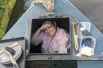 the woman shares her experience of living on a narrowboat, highlighting both the challenges and rewards of this unique lifestyle. Despite struggles with unexpected expenses and the lack of amenities like a working shower, she finds freedom and fulfillment in the boating community and the opportunity to live a simpler, more hands-on life.