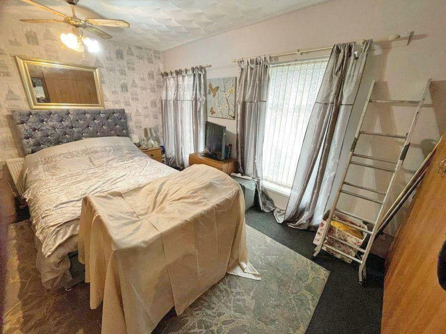 inside the modern two-bedroom house in Tonypandy, Wales available at an auction for a bargain.
