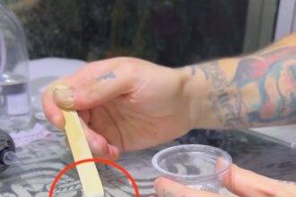 A tattoo artist honors his late father by using his ashes to ink a Tupperware label on his leg, recalling cherished memories of cooking together.