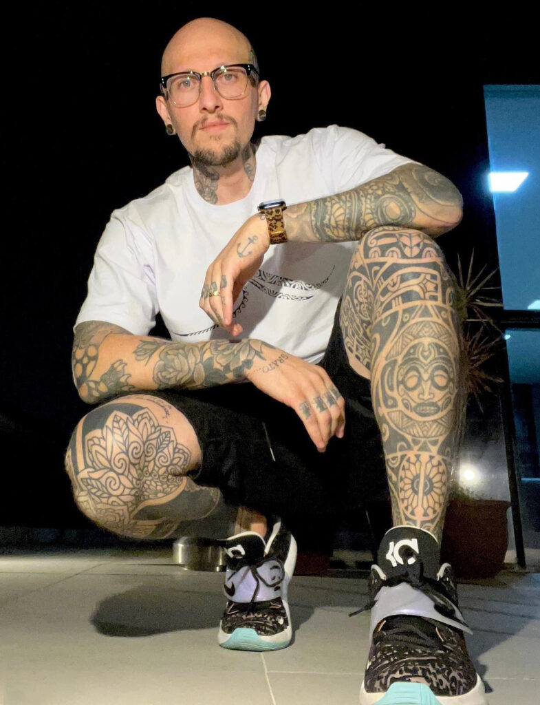 A tattoo artist honors his late father by using his ashes to ink a Tupperware label on his leg, recalling cherished memories of cooking together.