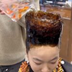 A daring woman in China gets a bold haircut, with her hair fashioned into a tall bowl and live goldfish poured into the hollow. The unusual style, done by hairstylist Lao Qiao, sparks mixed reactions online, with some finding it creative while others criticize it as cruel.