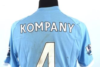 Vincent Kompany's mud-covered Manchester City shirt, worn in a 2010 match, sells for £715 in auction. Other grubby football kits fetch hundreds too.