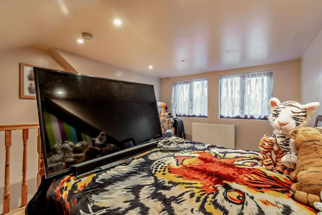 For £189,000, a three-bedroom house in Wednesbury boasts a unique tiger-themed interior, featuring prints, ornaments, and even duvets, adding a quirky touch to the property.