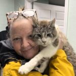 Chuffed woman reunited with her cat Kevin Durant after seven years, found living with strays a mile from home. Kevin is now back with Liz, receiving treatment, and adjusting to home life again at age 12.