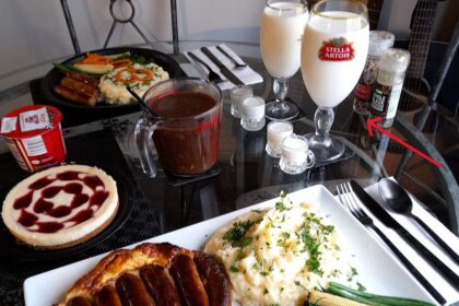 A couple's posh meal draws attention as they sip milk from Stella Artois glasses, sparking debate over drink choice. Viral sensation with 1,000+ comments.
